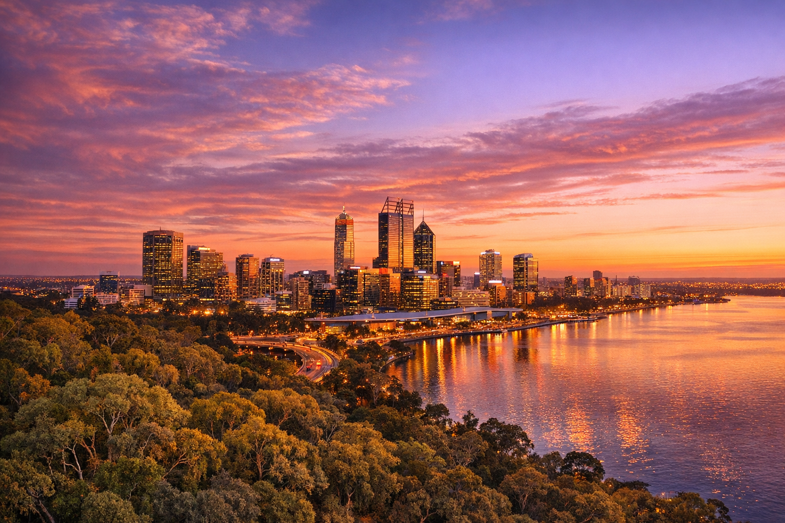 A breathtaking aerial photograph of Perth's gleaming city skyline captured during golden hour, where warm amber and rose-gold sunlight bathes the modern glass skyscrapers in a soft, luminous glow. The Swan River winds gracefully through the scene below, its calm surface reflecting shimmering ribbons of orange and pink light like liquid gold. In the foreground, the lush green canopy of Kings Park stretches across the elevated escarpment, its dense native bushland creating a stunning natural contrast against the urban skyline beyond. The sky transitions from deep burnt orange near the horizon to soft lavender and dusty blue higher above, with wispy clouds catching the last rays of the setting sun. Shot with a wide-angle lens from a high vantage point, the composition captures the perfect balance between Perth's vibrant cityscape and its extraordinary natural surroundings, with the river acting as a mirror between the two worlds. The warm, cinematic lighting gives the entire scene a dreamy, almost painterly quality, with the city lights just beginning to flicker on as dusk approaches, creating a magical twilight atmosphere that feels both epic and intimate.